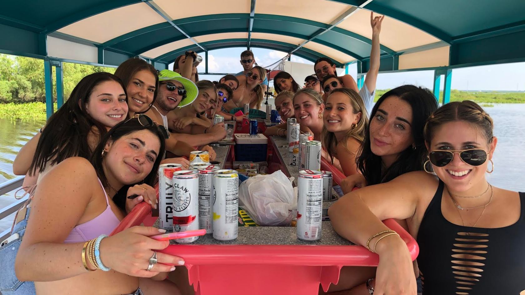 a group of people sitting at a table posing for the camera