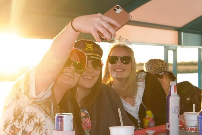 a woman sitting at a table with a cup of coffee